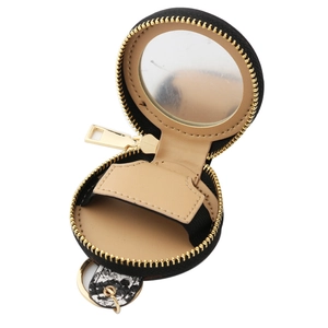 Vue détaillée du mini étui en cuir PU rond avec miroir interne et sangle pour rouge à lèvres