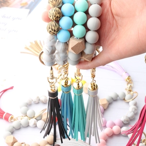 Silicone bead keychain bracelet with marble print, wooden beads and leather tassel