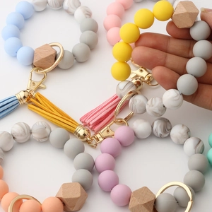 Silicone bead keychain bracelet with leather tassel and wood bead for women