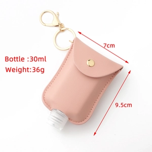 Detailed view of 30ml pink leather hand sanitizer holder with dimensions and keychain