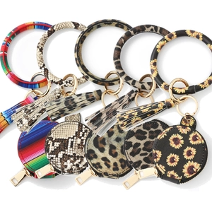 Porte-clés Bracelet en Cuir PU Pochette Ronde Avec Miroir Support Écouteurs Gland Portefeuille Poignet Accessoire Femme
