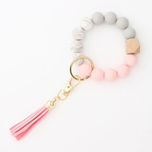 Silicone and wood bead wristlet keychain with pink leather tassel and gold metal clasp