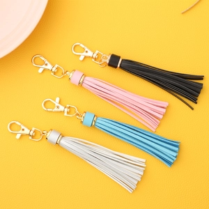 PU leather tassel keychain charms in black, pink, blue and white colors with gold metal hooks
