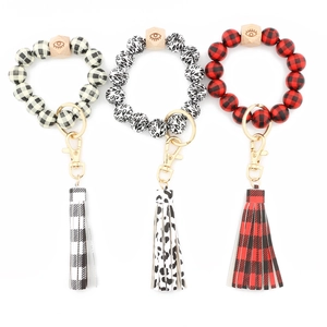 Beaded wooden keychain bracelet set with leopard print, plaid patterns and leather tassels