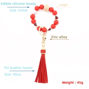Kerst siliconen kralen armband sleutelhanger met houten kraal en rode PU kwast