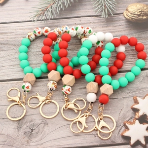Porte-clés Bracelet en Perles de Silicone de Noël pour Femmes Père Noël Bonhomme de Neige Perles Imprimées Avec Perle en Bois Hexagonale Cadeau