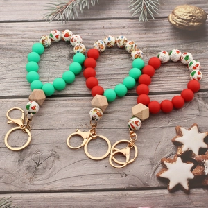Lot de trois bracelets et porte-clés en perles de silicone de Noël avec motifs Père Noël