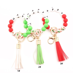 Christmas silicone bead keychains with wood beads and leather tassels in three festive styles