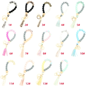Lot de 14 porte-clés en perles de silicone avec pompons en cuir et perles de hêtre