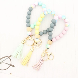 Pastel silicone bead keychain wristlets with beech wood beads and leather tassels