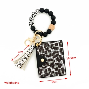 Detail showing dimensions of leopard rhinestone card holder with beaded bracelet keychain