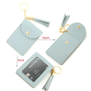 Light blue faux leather card holder keychain with tassel and clear ID window view