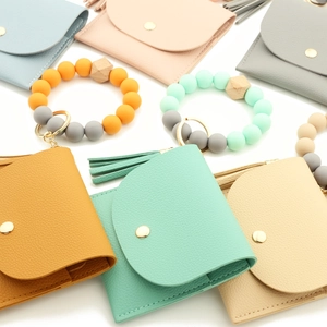 Close-up of colorful silicone bead bracelets with PU leather wallets and tassels