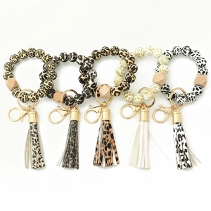 Lot de 5 bracelets porte-clés en silicone à imprimé léopard avec pompons en cuir PU