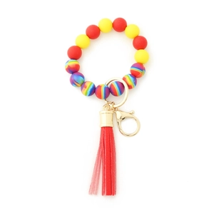 Porte-clés bracelet en perles de silicone colorées avec perles en hêtre et pompon rouge