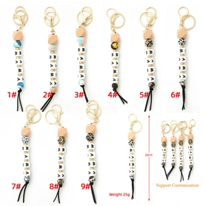 Silicone and wood bead keychain wristlet with MAMA letter beads and black tassel