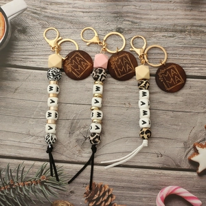 Silicone bead keychain set with wood discs and MAMA lettering on grey wood background