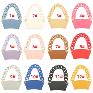 Matrix showing 12 macaron colors of leather coffee cup sleeves with acrylic chains