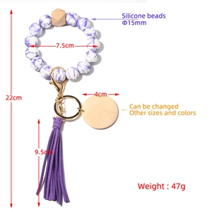 Purple marble silicone bead wristlet keychain with wooden pendant and suede tassel