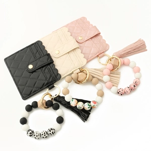 Silicone bead bracelet keychain with quilted leather card wallet and stylish tassel