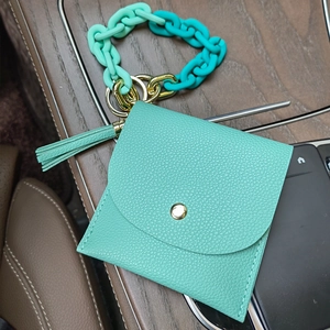Detail view of mint green PU leather coin purse with gradient chain and fringe tassel