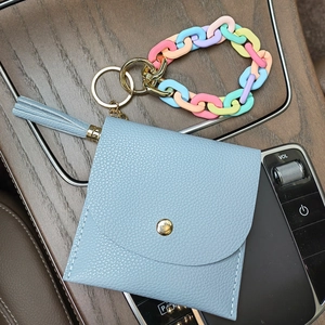 Light blue faux leather card holder with tassel, metal key ring and acrylic chain handle
