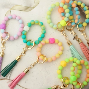Luminous silicone bead wristlet keychain with leather tassel and gold metal ring in macaron colors