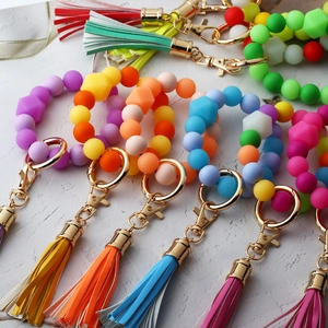 Luminous silicone bead wristlet keychain with metal spring clasp and leather tassel