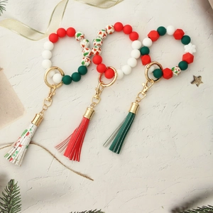 Christmas silicone bead bracelet keychains with tassels and festive gold hardware charms