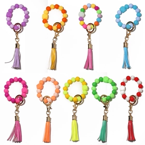 Luminous silicone bead keychain bracelets with tassels in nine vibrant assorted colors