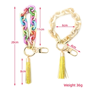 Macro view of acrylic keychains with colorful gradient and marble texture chains