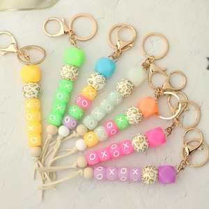 Glow in the dark silicone bead keychain bracelets with XOXO charms and tassels