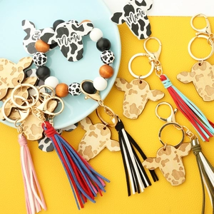 Western style cow head keychains and beaded wristlet with leopard print and fringe