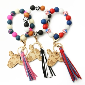 Silicone and wooden bead wristlet keychain set with cow head charm and fringe tassels