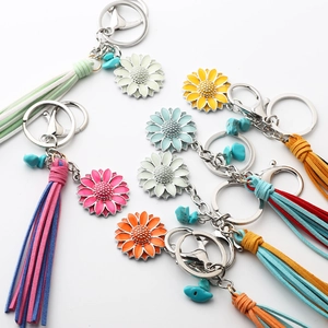 Luminous sunflower keychain with colorful leather tassels and turquoise stone pendants