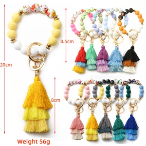 Dimensions of the silicone bead keychain with floral patterns and a triple-layer cotton tassel