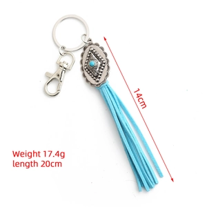 Detail of bohemian turquoise keychain showing tassel length 14cm and total length 20cm
