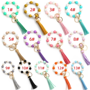 Detailed grid view showing thirteen colorful silicone bead bracelets with tassels and gold clasps