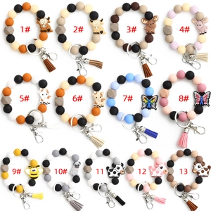 Bracelets porte-clés en perles de silicone avec breloques animaux et pompons colorés