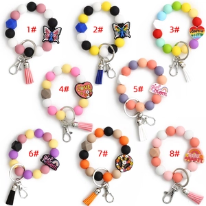 Bracelets porte-clés en perles de silicone avec breloques animaux et pompons colorés