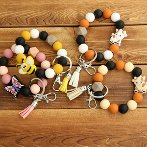 Bracelets porte-clés en perles de silicone avec breloques animaux et glands sur bois
