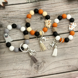 Bracelets porte-clés en perles de silicone avec pompons en cuir et breloques animaux