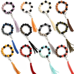 Set di 12 braccialetti portachiavi retrò con perline leopardate e nappe in pelle