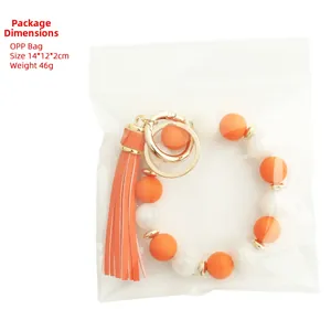 Silicone bead keychain with marble pattern, orange leather tassel and golden ring buckle
