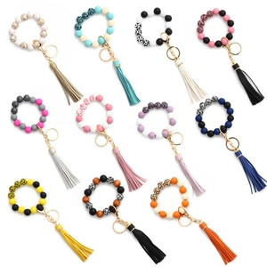 Bracelets porte-clés rétro en perles de bois avec glands en cuir et motifs léopard