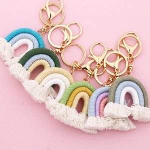 Handmade woven rainbow keychain with cotton tassels and gold metal clips in multiple colors