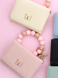 Detailed view of leather card holder wallets with bead wristlets and butterfly buckle