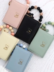 Five colorful leather card holders with butterfly charms and silicone beaded wristlets
