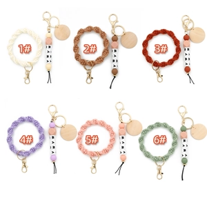Detailed grid of MAMA letter silicone bead keychains in six various pastel woven cotton colors