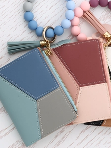 Silicone bead keychain bracelet with a geometric leather wallet and tassel accessory